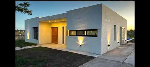 Aberturas instaladas en fachada de hogares - Carpintería Total