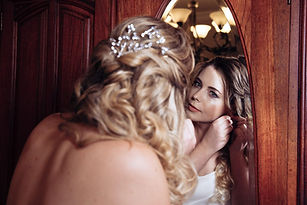 Elegant bridal hairstyle with polished makeup look.