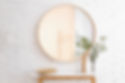 Big round mirror, table with jewelry and