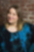 A photo of Donna smiling and looking towards the camera