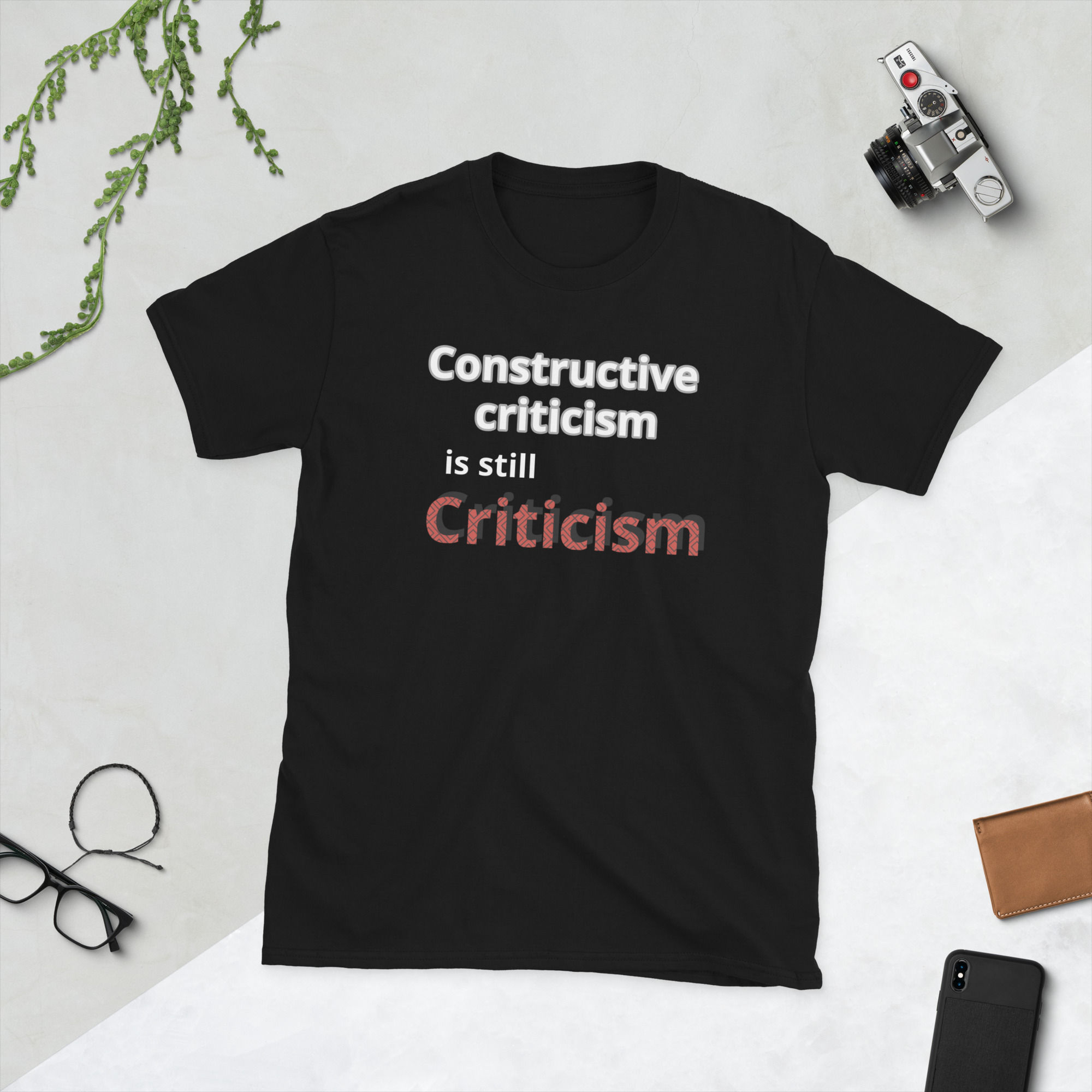 Black t-shirt with text: Constructive criticism is still Criticism.