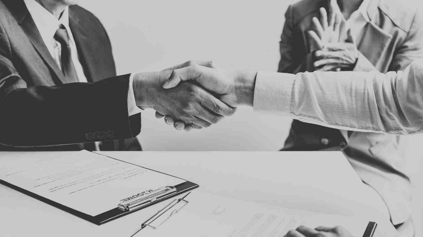 Successful employee and employer handshake at North