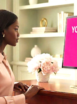 A woman looking at a computer screen that says that her money mix equals 130%