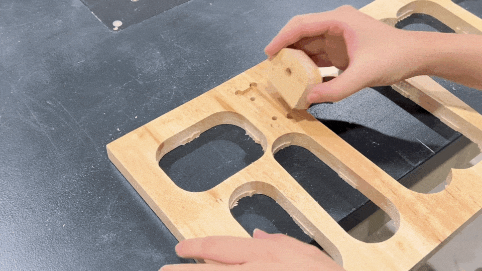 Carefully insert the neck piece into the designated slot.