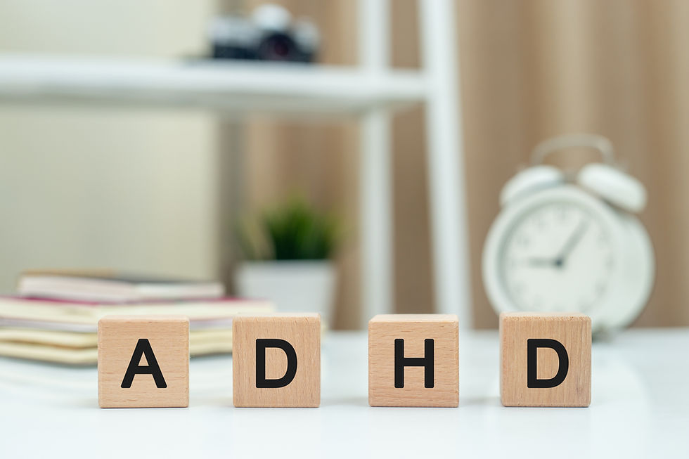 Abbreviation of ADHD on wood cube block on white table Attention Deficit Hyperactivity Dis