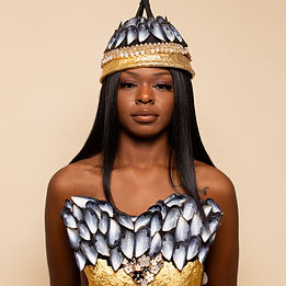 Model with papertunity created breast plate and hat