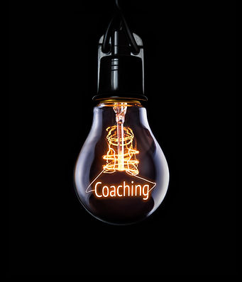 Hanging lightbulb with glowing Coaching