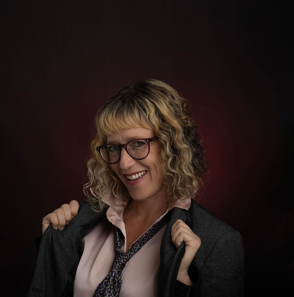 Host of She's Unbound Podcast smiling in business attire