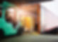 Forklift Tractor Loading Package Boxes on Pallet into Cargo Container. Trailer Truck Parke