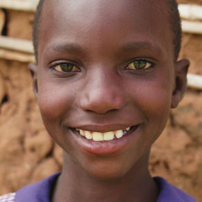 A child in motion during a structured play session, filmed at eye level in documentary style, focused on safety and humanity.