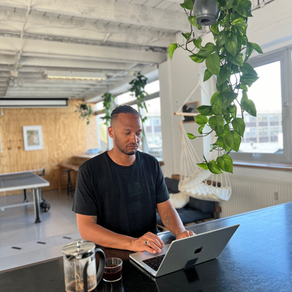An editor working on a documentary timeline with audio and transcript on screen, focused on human story and nuance.
