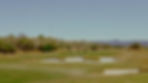 Golf course with four golfers on near the pin.