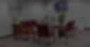 Dim image of waiting area with chairs and plants