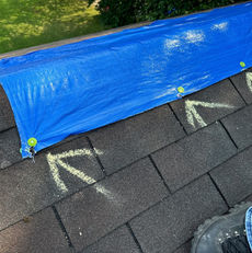 3G General Construction securing an emergency tarp on a roof in Raritan, NJ.