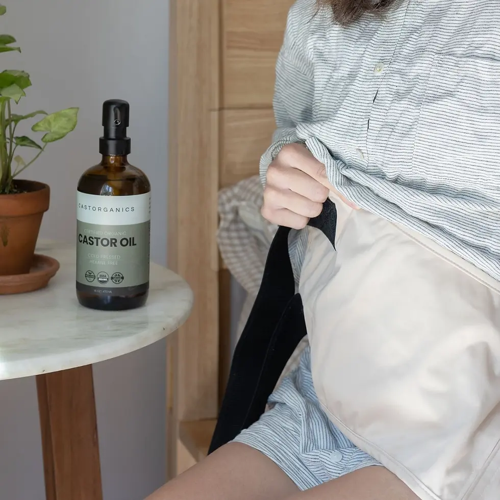 Thumbnail: Person sitting by bed, CASTOR OIL bottle on table with plant.