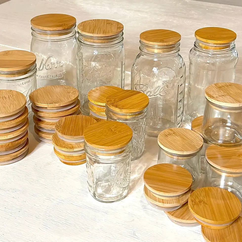 Thumbnail: Multiple clear glass jars with natural bamboo lids on a white surface.