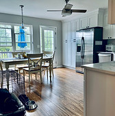 Modern kitchen remodel featuring sleek countertops, stainless steel appliances, contemporary cabinetry, and efficient space u