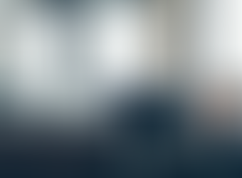 A woman looking at her computer at her office