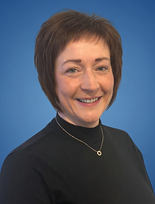 Smiling portrait of Roberta in blue.png