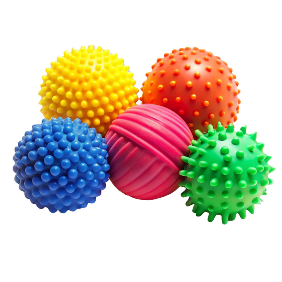 Various colorful spiky balls in a group on a black background