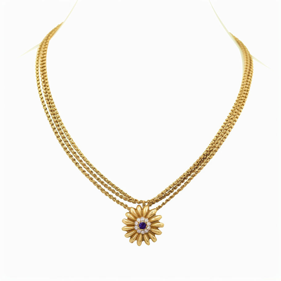 Golden necklace with a flower pendant and purple center stone. I am a Product