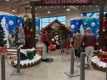 Santa visits with Young ones at a Store