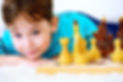 Little boy playing chess at home. Games and activities for children. Family concept..jpg