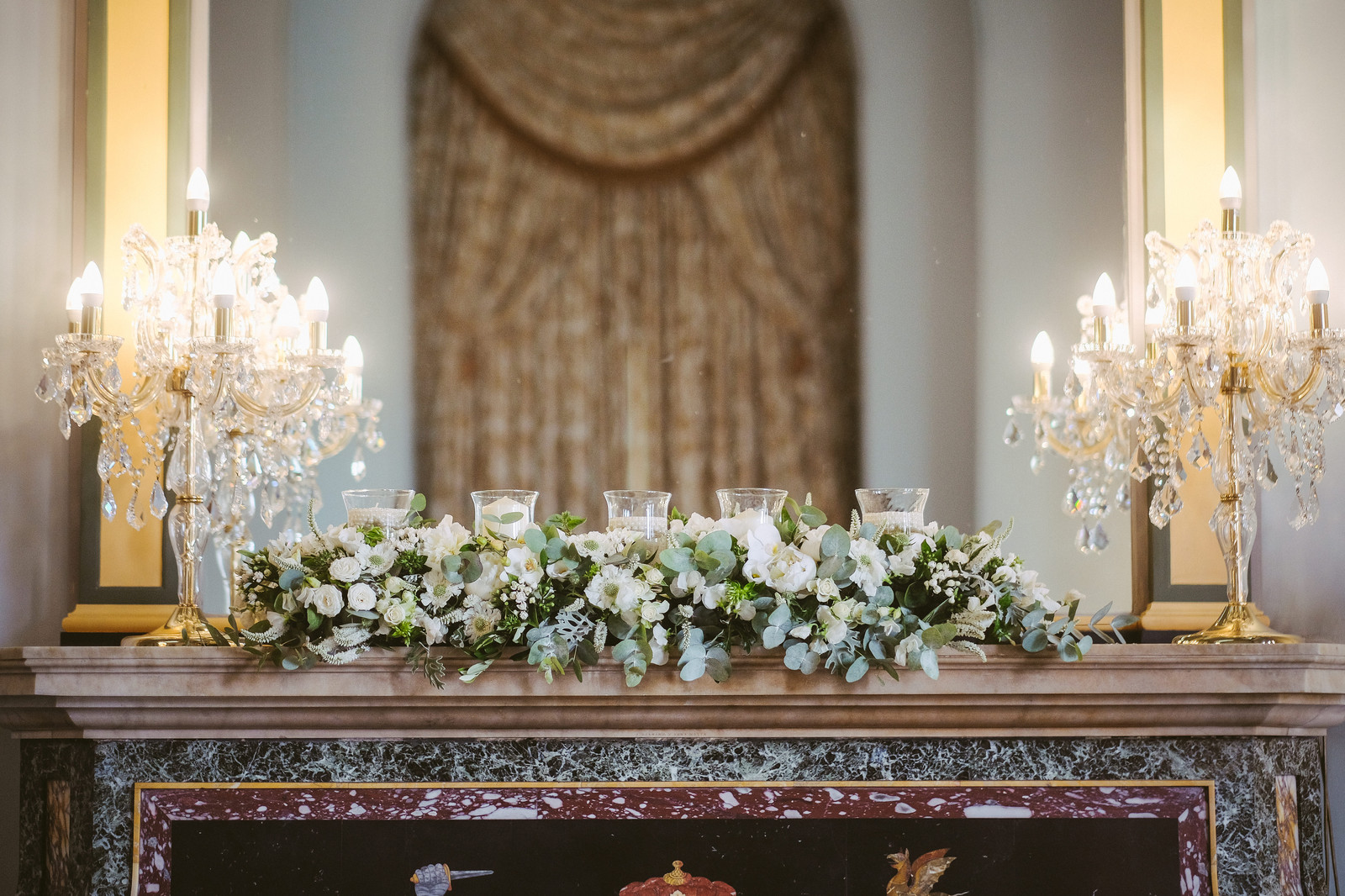 White and Green Flower Fireplace Decor with candles - Wynyard Hall