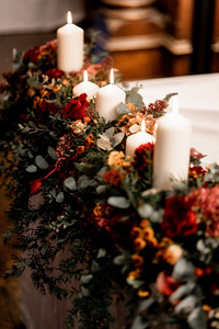 Jesmond Dene House wedding ceremony, with autumnal registrar / signing table wedding flowers which will later be transferred to the top table