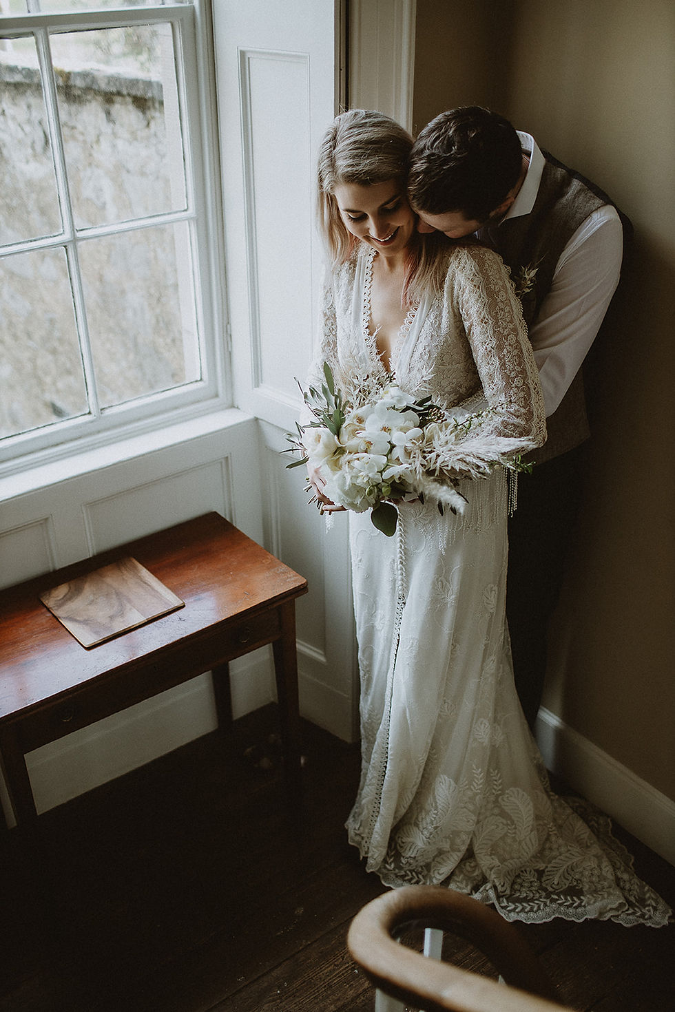 Bride & Groom in Northumberland. Beautiful rustic and luxurious bouquet of dried flowers, pampass grass, orchids and roses with buttonhole to match