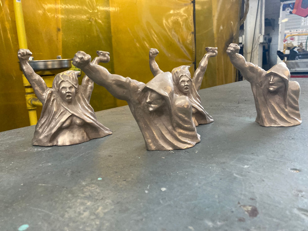 Bronze castings of the figures before patina.