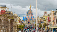 Crowds walking down Main Street U.S.A. toward Cinderella Castle at Magic Kingdom in Walt Disney World