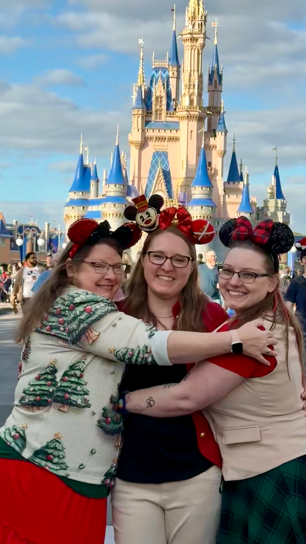 Practically Perfect Pixie Dust trio  in front of Cinderella Castle at Christmas
