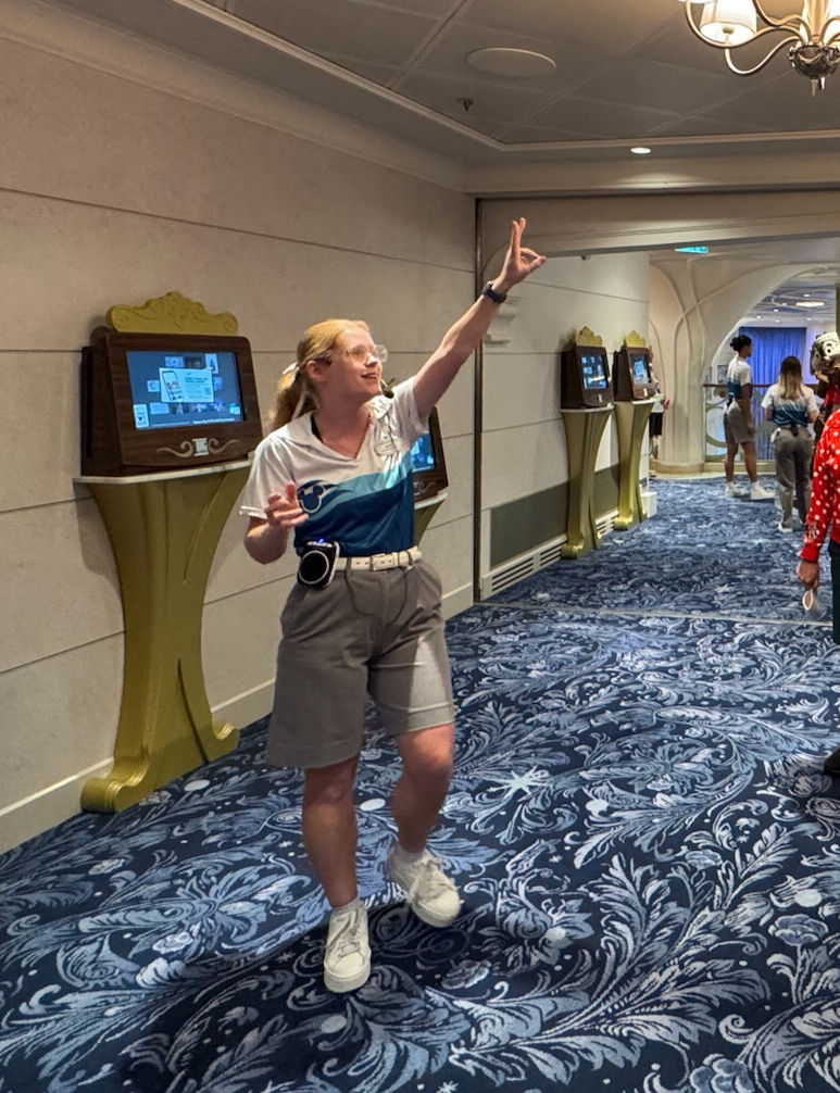 A crew member on the Disney Wish leads a boat tour.