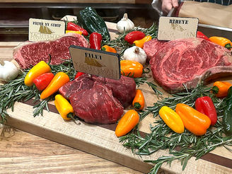 SteakSteak Selection surrounded by garlic, peppers, and Herbs at the Yachtsman Steakhouse