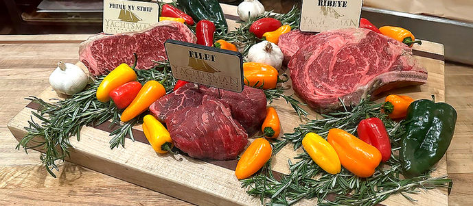 SteakSteak Selection surrounded by garlic, peppers, and Herbs at the Yachtsman Steakhouse