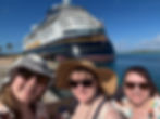 Pixie Dust trio in from of the Disney Wish on Castaway Cay 