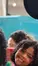 A family taking a picture with Mickey Mouse
