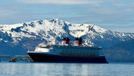 Disney Magic in front of a snowy mountain in Icy Point Straight near Hannah, Alaska