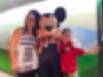 Lyn and College Boy (back in the day) with Mickey Mouse at Garden Grill in EPCOT