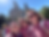 A family smiling in from of the Hogwarts Castle at the Island of Adventure in Universal Orlando Resort.
