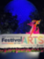 Festival on the Arts sign in from of Spaceship Earth at Night