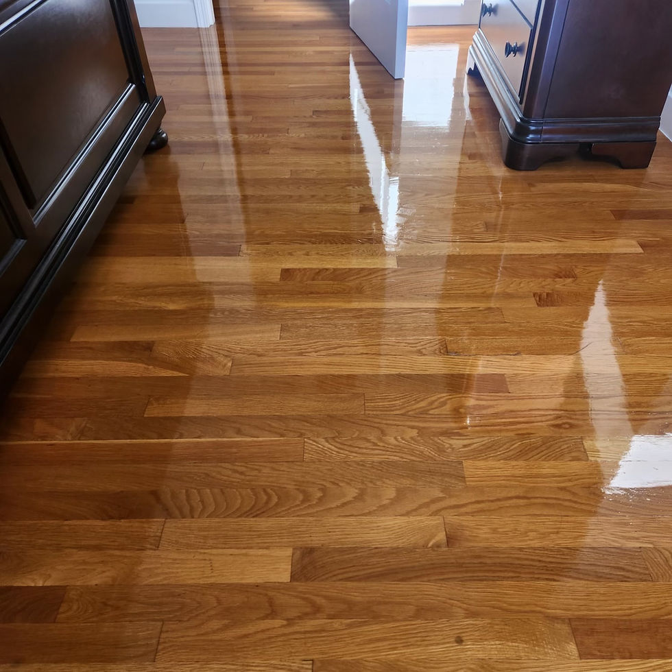 Polished wood floor after professional wax removal, cleaning, polishing, & sealing.