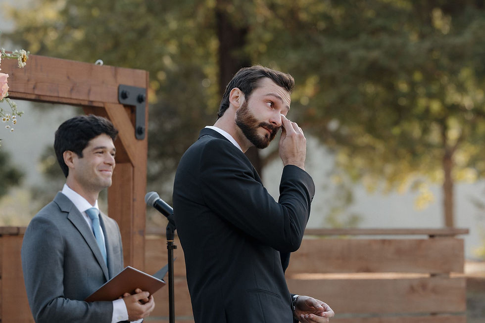 Groom's emotional reaction as bride walks down the aisle at Tar Creek Ranch