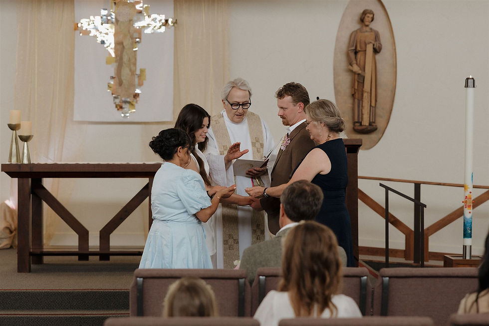 Couple exchanging rings in intimate San Luis Obispo church micro-wedding by San Luis Obispo Wedding Photographer