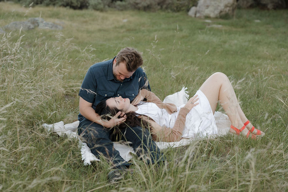 Couple embracing beneath trees during Bishop Peak engagement session