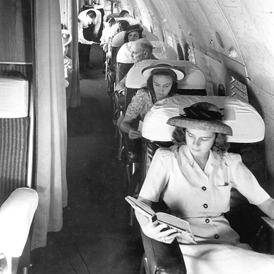 Passemgers riding in a vintage aircraft