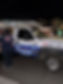 Service person wearing a Leo's Plumbing work shirt with a service truck in the background at a job site in Murrieta

