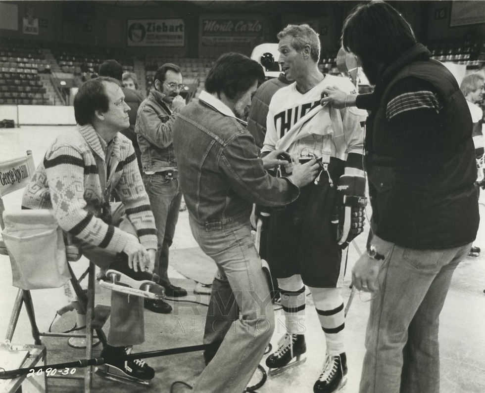 George Roy Hill (seated) and Paul Newman on the set of Slap Shot, Universal Pictures, 1977