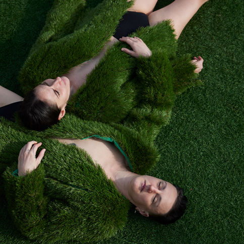 Alethea Alexander and Hannah Simmons wearing astroturf suit jackets